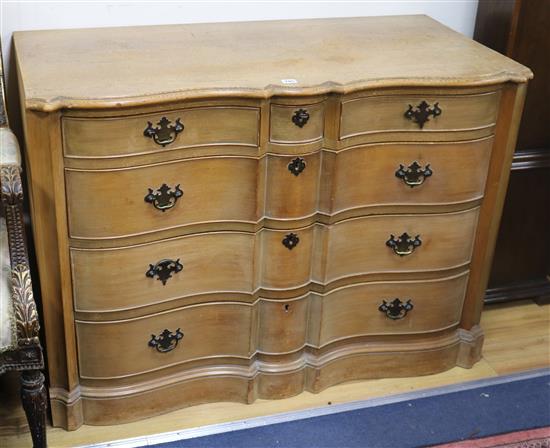 A pair of serpentine pine commodes W.114cm